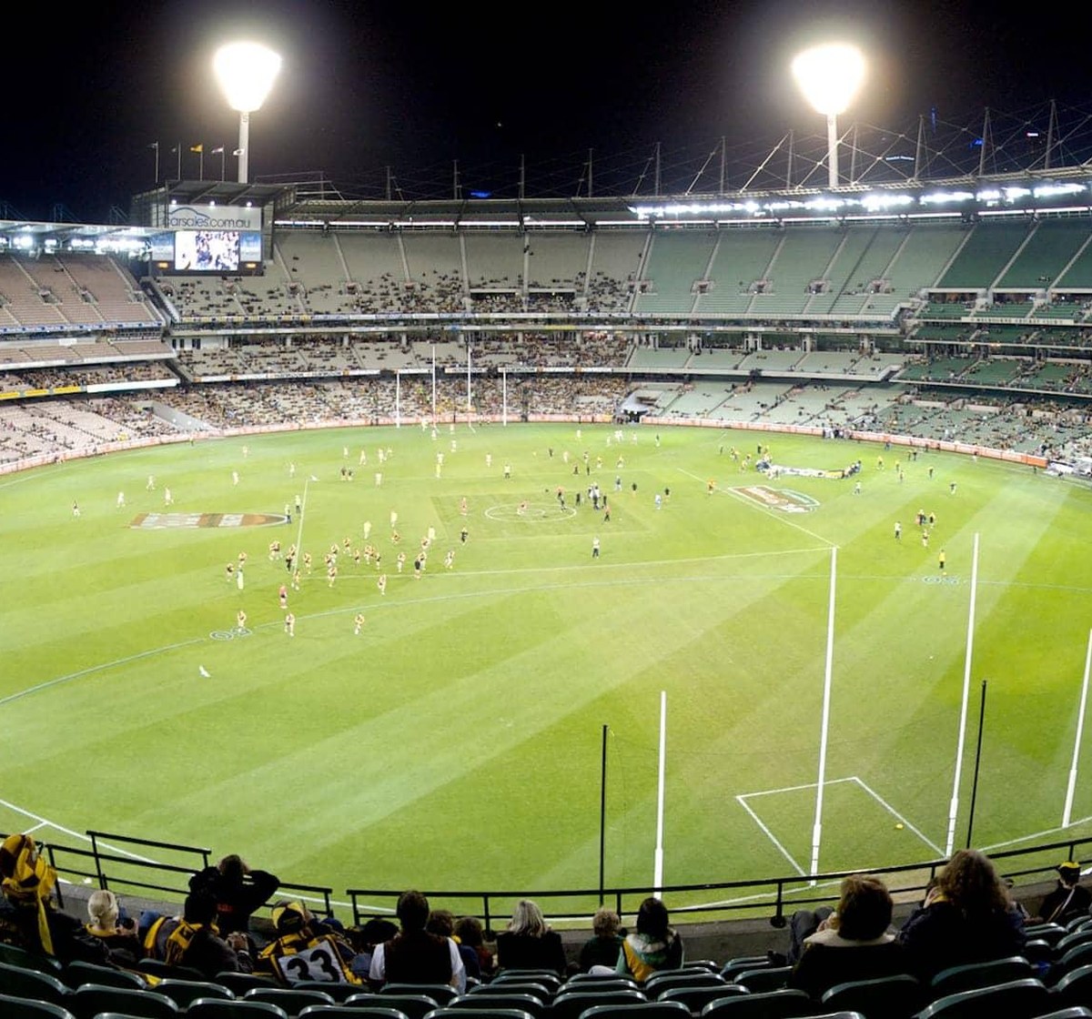 A night football match at a floodlit stadium