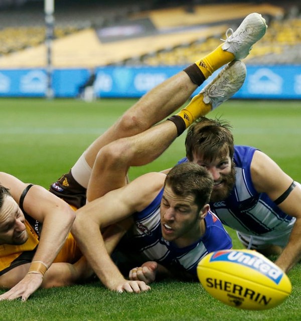 AFL players contesting the ball during a match